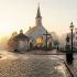 A historic and peaceful colonial town square representing traditional community values.