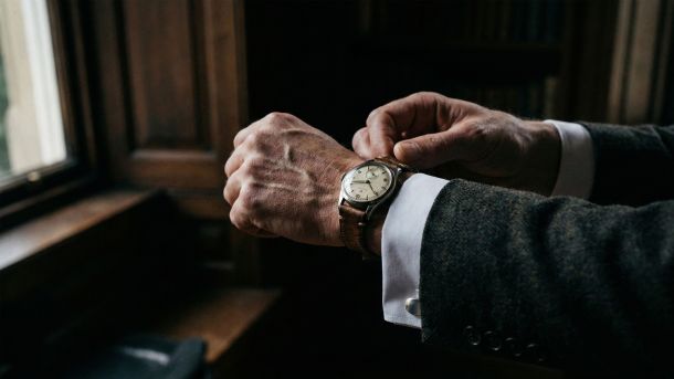 A man preparing with focus, symbolizing the mastery of sexual education and understanding.