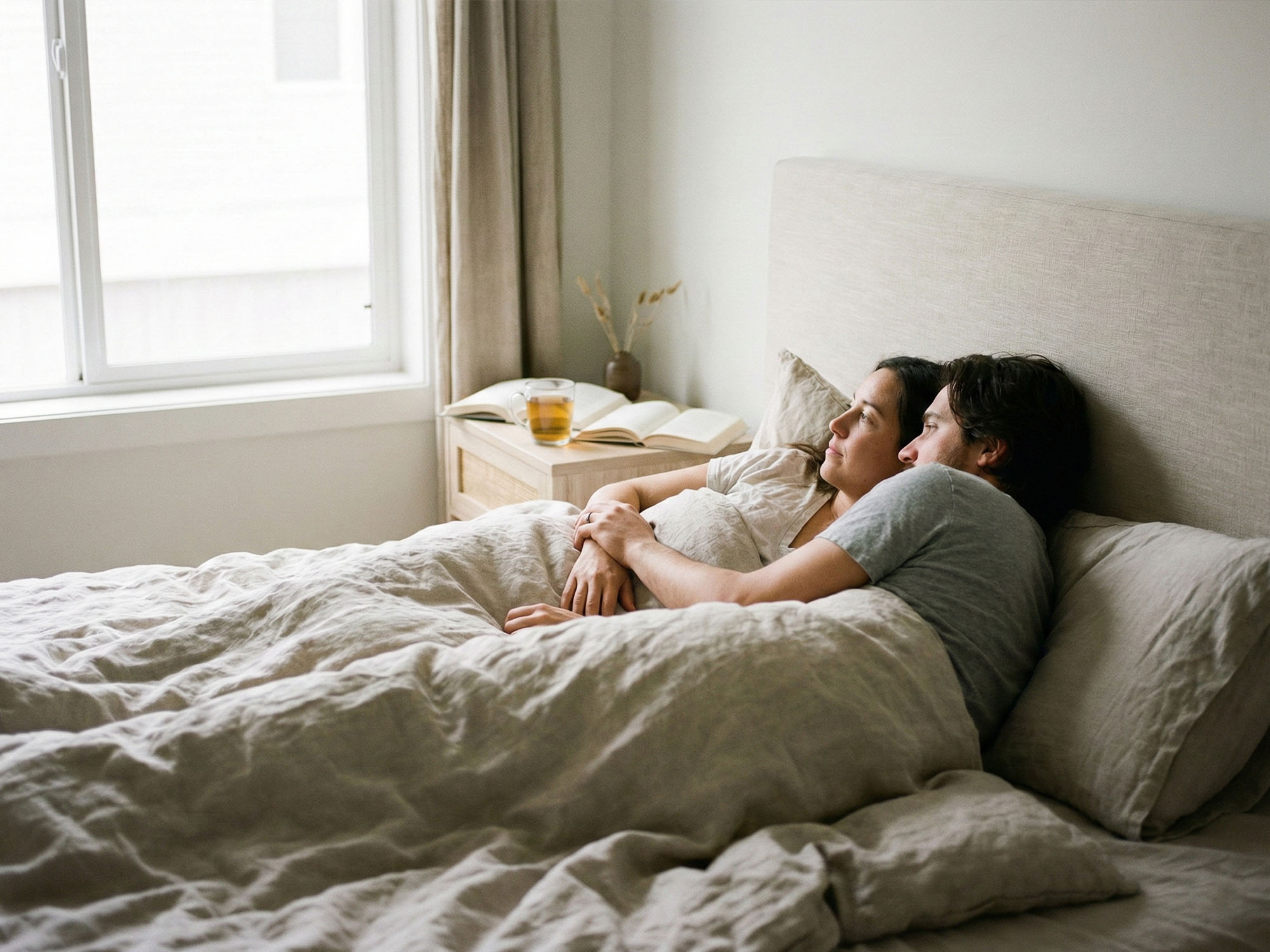 A quiet bedroom scene symbolizing love, intimacy, and unspoken thoughts
