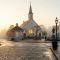 A historic and peaceful colonial town square representing traditional community values.